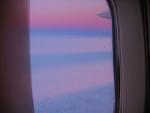 The contrails of our 747 lit up by the sunset.