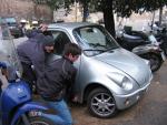 Trying to flip a truly tiny car. The police were just around the corner, so we didn't go any further.
