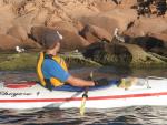Paddling by pelicans